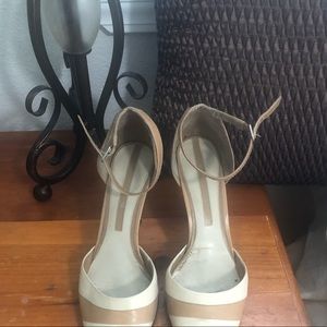 Enzo Angiolini beige and cream shoes with strap. Size 7.5. Has spot on the back.